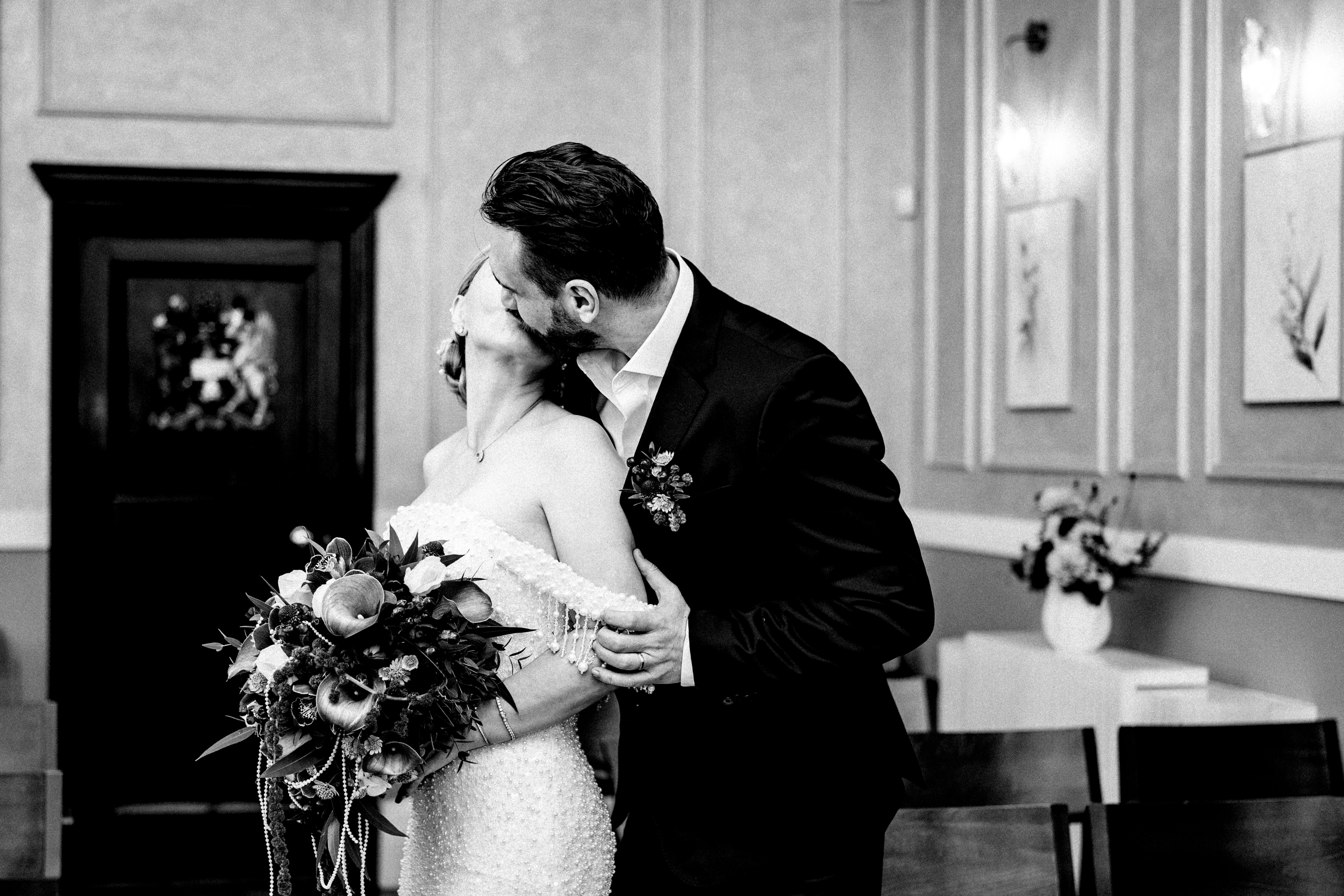 A tender kiss from the groom to his beautiful bride.