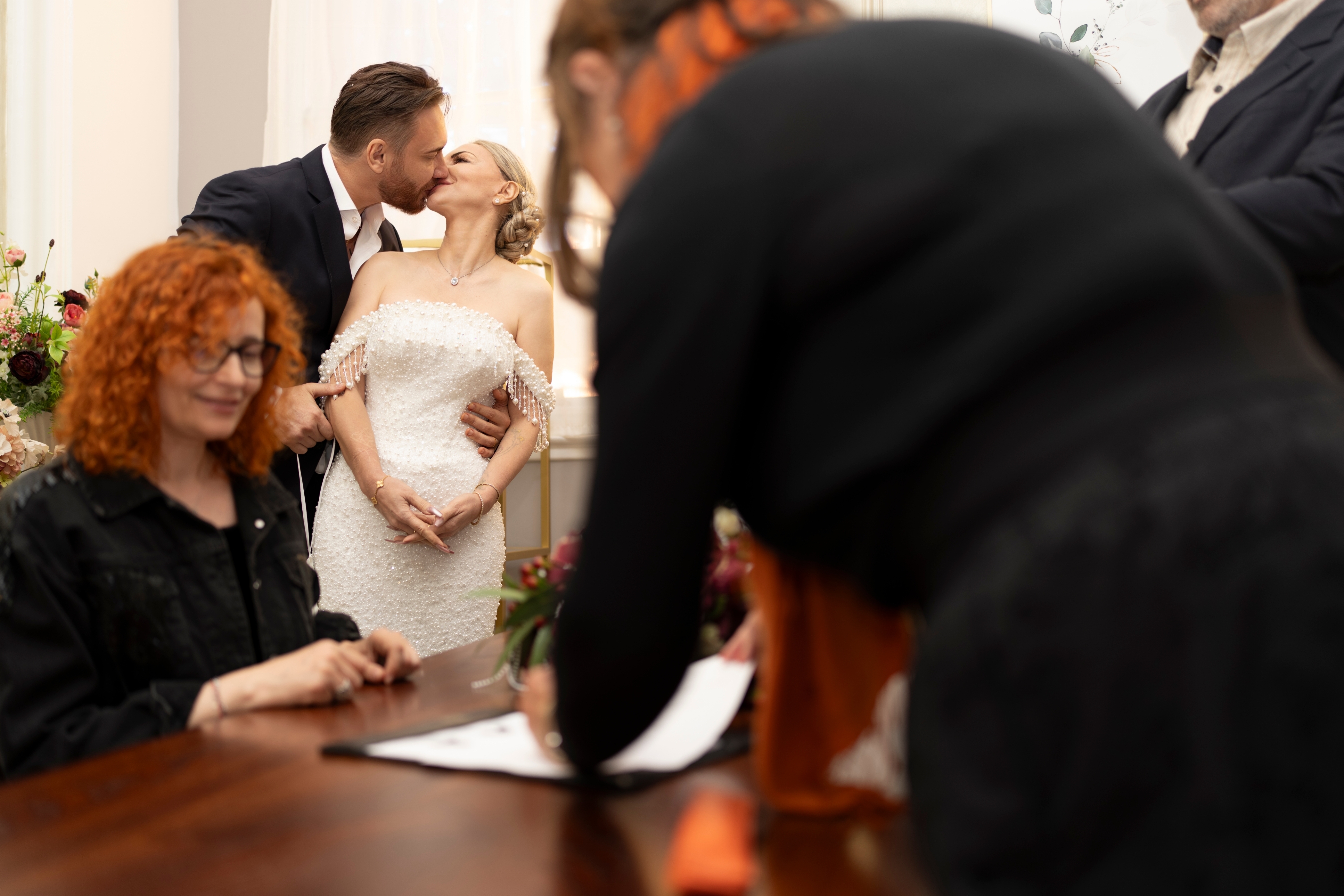 A loving kiss shared between the newlyweds during their civil ceremony.